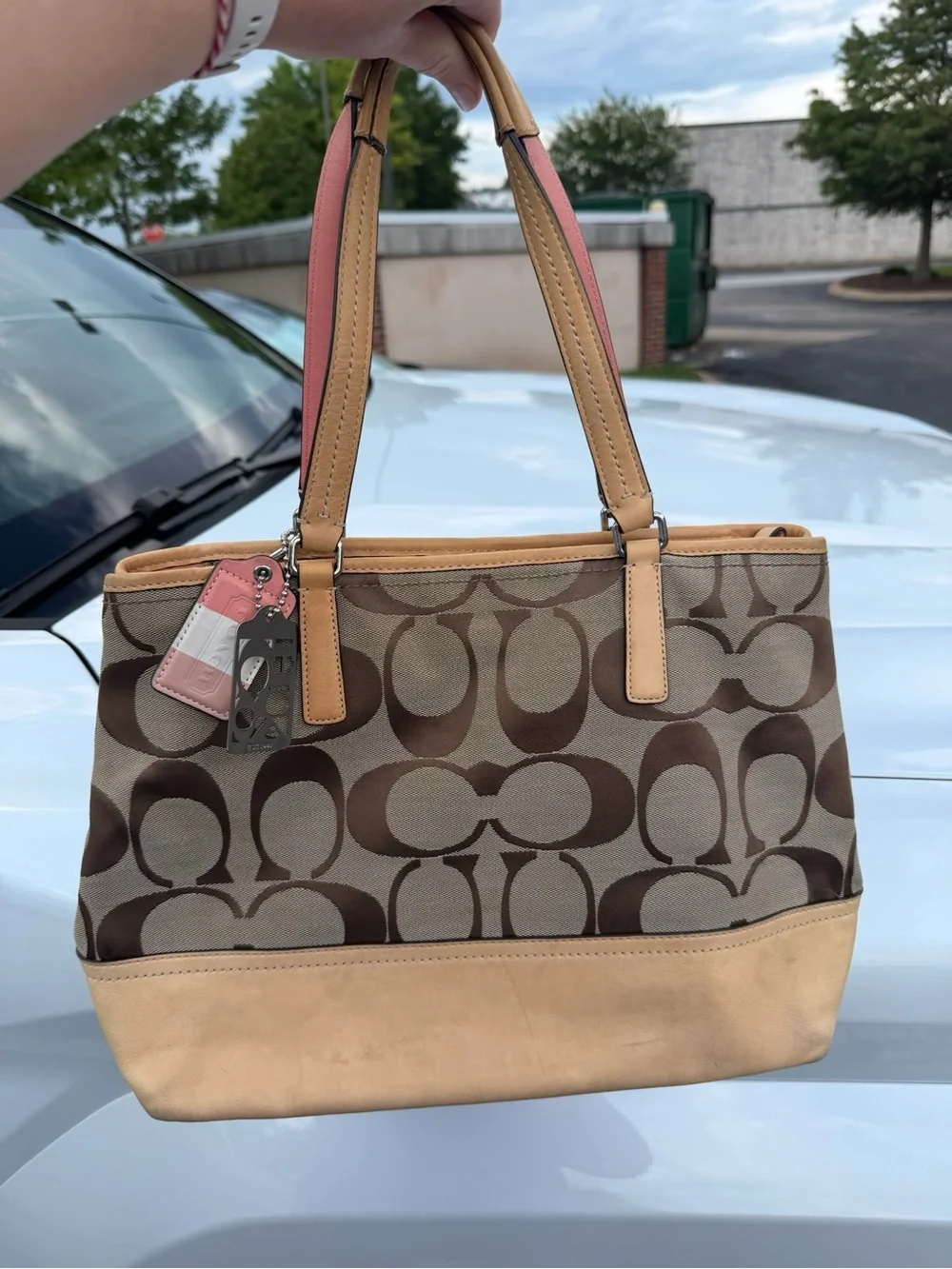Coach Brown Signature Canvas Tote with Tan Trim and Pink Handle Accent